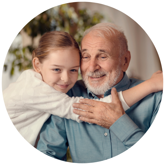 Young child hugging an older adult in a warm, supportive moment at home.