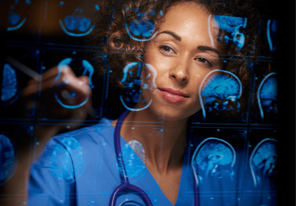 A female healthcare professional in blue scrubs looks thoughtfully through a display of brain scan images, reviewing multiple MRI slices reflected in front of her during clinical analysis.
