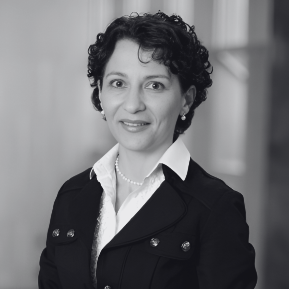 Headshot of Dr Dronca in black and white